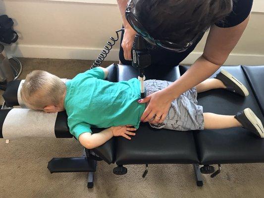 Dr. Janelle working her magic on my now 2 yr old. He loves laying down for his adjustment!