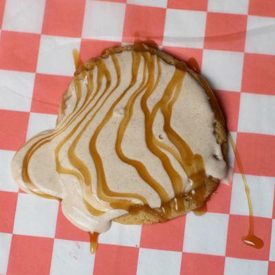 A really good cookie. Sugar cookie with homemade cinnamon vanilla sauce topped with caramel.