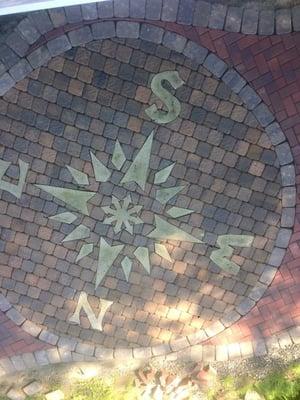 A beautiful 16' compass rose custom made and built into this patio.