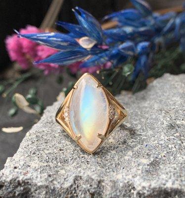 Custom made 14k yellow gold moonstone ring with diamond accents.