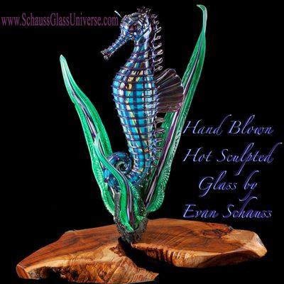 Huge hand blown glass seahorse that lights any and all colors from within (LED) on Maui Koa wood base. EPIC!