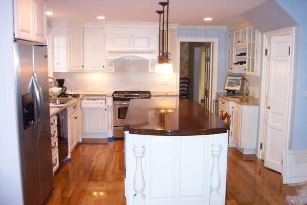 Cherry wood top on this island built with seating and functionality.