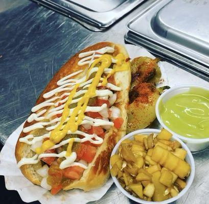 Sonoran Style Hot Dog with a side of our fresh cucumber-mushroom in soy sauce and guacamole sauce made from 100% real avocados