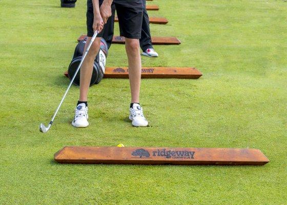 Ridgeway Country Club member practicing golf swing on the driving range