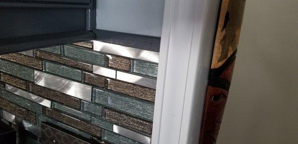 Molding added to the backsplash to prevent falling