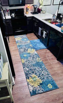 The kitchen is spacious and boasts energy efficient appliances. **No, those are not dirty dishes I just noticed in the sink. LOL**