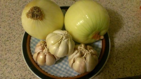 They pre-clean some of their produce. The outer skins on these onions and garlic have been removed by them! :)