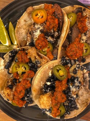 Cauliflower and black bean tacos (front), Mushroom and onion tacos (back)