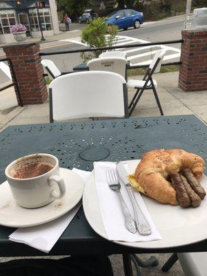 Medium latte and breakfast sandwich. Around $8.50.