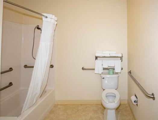 Each Accessible Double Queen guest room has a private bathroom with an accessible combination tub/shower, vanity, toilet, and hair dryer.