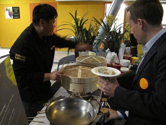 the catering setup with the steamed dumpling bar