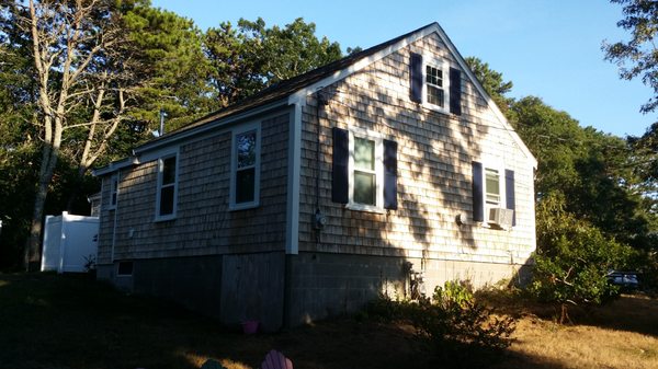 Cape Cottage - We Bleached the shingles, painted the trim and to finish it off painted the shutters a custom blue color from Sea Port Shutte