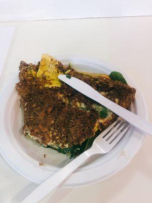 Buckwheat crepe with scrambled eggs, cheese, bacon and spinach.