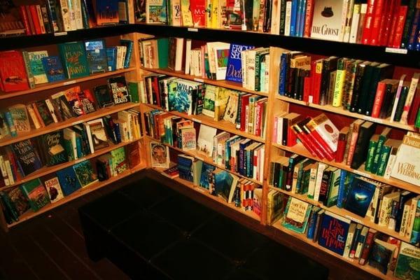 Not only do we have tables, chairs, and couches, we also have many leather benches conveniently located by book shelves.