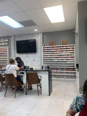 Large wall of nail polish and sns powder options