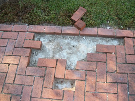 Paver bricks being relayed.