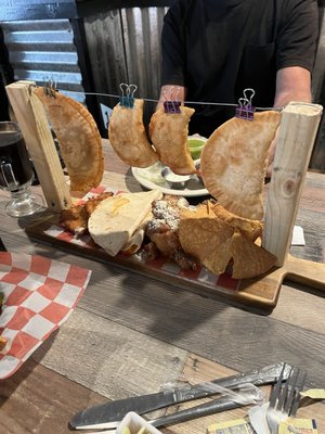 Trading post sampler (one chicken and one steak empanada, 4 wings, 2 mozzarella triangles, one cheese quesadilla and 2 homemade pierogies