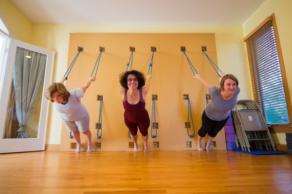 Playing on the yoga ropes wall at Yoga 4 All Bodies, Reston, Virginia.