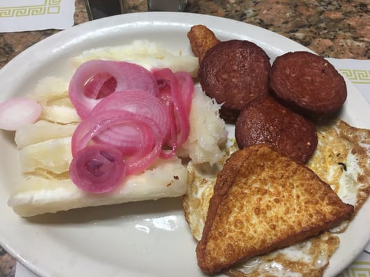 Breakfast of queso frito huevos salami and yucca