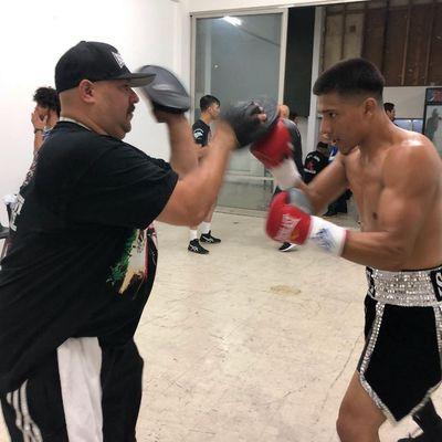 Luke and CapetilloJr warming up before a fight