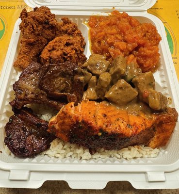 Lamb chops, salmon, steak & gravy, chicken wings, candied yams & rice "Zahid platter"