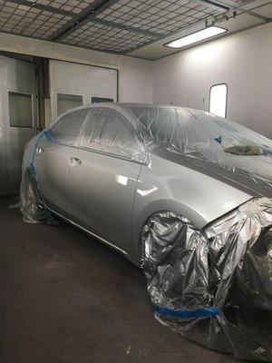 2014 Toyota Corolla in paint after fender replacement and Front door Repair.