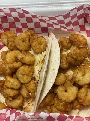 Two shrimp tacos with slaw and sauce on it not sure what kind of sauce but really good. $15.00. Very much fulfilling!