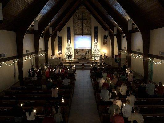 Silent Night by candlelight on Christmas Eve.