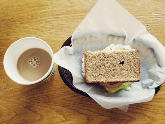 Half sandwiche with coffee