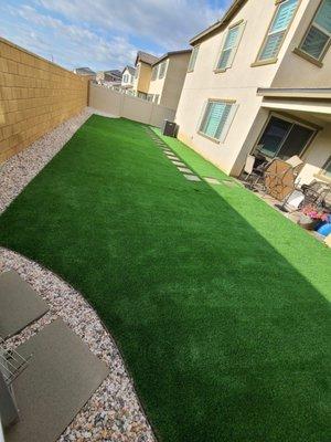 Backyard landscaping with artificial  grass