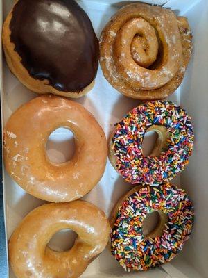 Boston cream, sweet potato cinnamon swirl, glazed, and chocolate sprinkles.