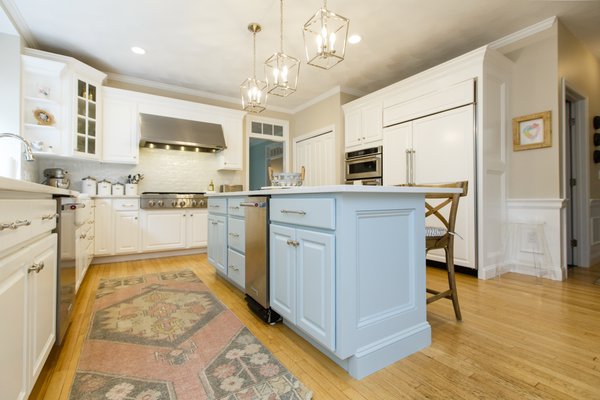 Kitchen remodel using existing cabinetry, light carpentry and cabinet painting.