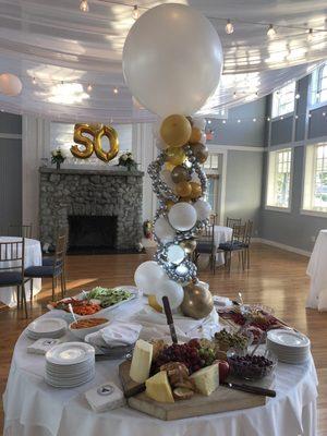 Elegant balloon display that coordinates w/ specialty gold metallic 50!