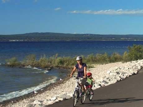 A favorite warm weather activity is biking along the Little Traverse Wheelway.