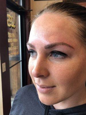 Eyebrow hair stroke tattoo .