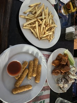 Mild and Garlic Parmesan wings with fries and mozzarella sticks