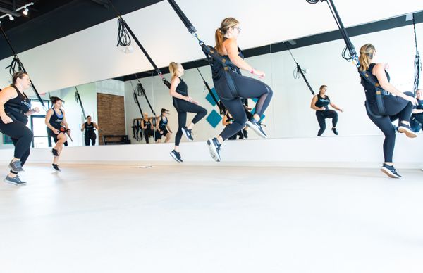 Learning how to fly during the bungee fitness class.