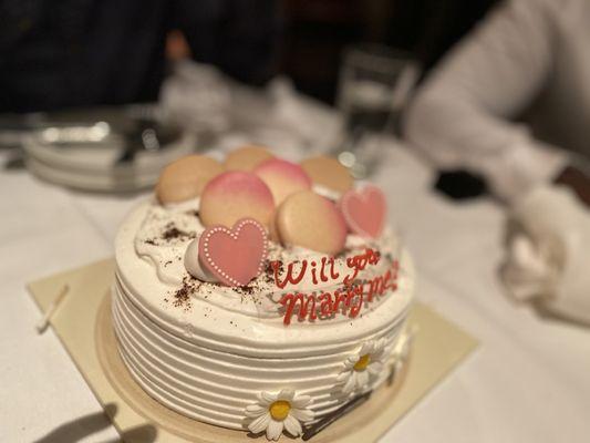 Triple delight coffee cake with macarons, edible flowers and heart