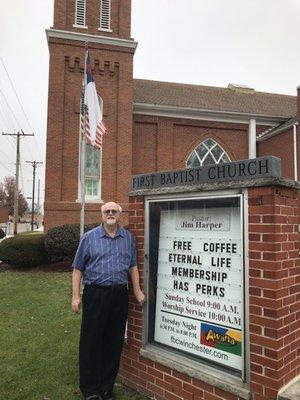 Pastor Jim Harper in front the church