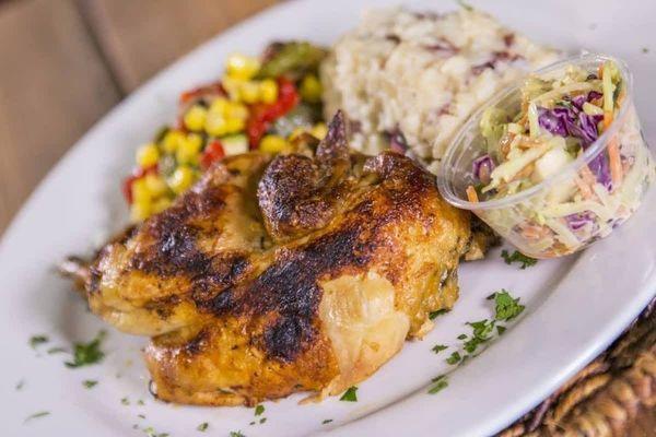 Classic half chicken with garlic smashed reds and spicy peanut slaw