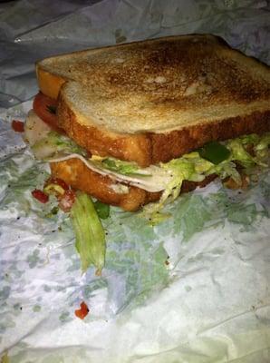 Turkey, American and an assortment of veggies on white. Whole sammy toasted. $5