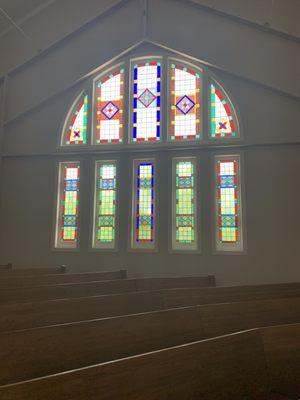 Through a renovation 9 years ago, the original stained glass windows were restored.  Gorgeous!