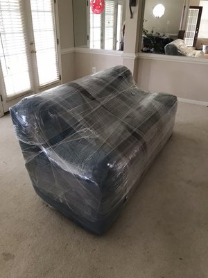 Couch: blankets and shrink wrap packing.