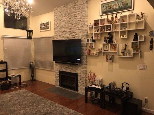 After the fire place was remodelled and Cody did the tiling of the marble ledger stone.