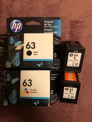 HP 63 ink cartridges. Black cartridge in color cartridge box, black cartridge without orange tape in black cartridge box.