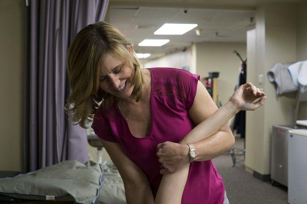 Karen stretching a patients shoulder