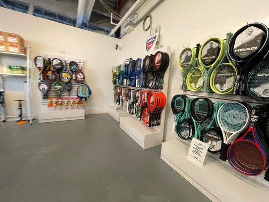 Wall of racquets and detailed pricing