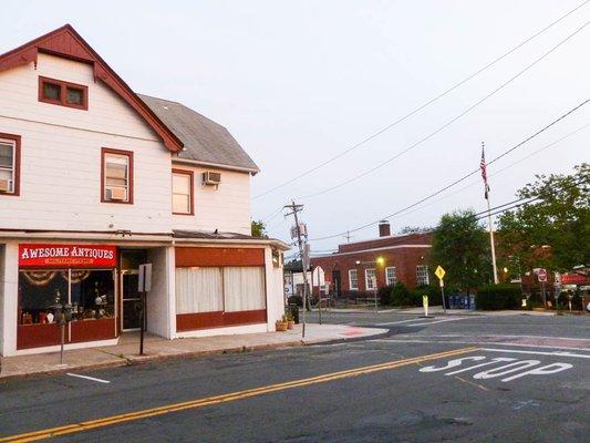 Store front showing cross on Main street from Pearl River Post office on right.