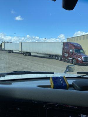 Jam packed parking lot of truckers waiting all day to be loaded but then getting turned away after waiting 8-10 hours