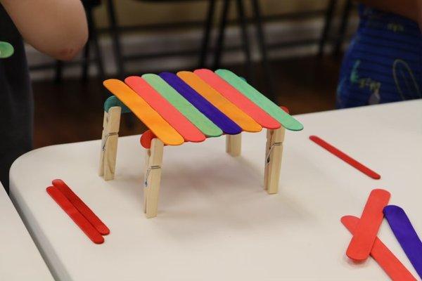 Cars and Popsicle stick bridges